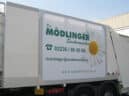 Truck outdoor advertising on garbage truck in Mödling