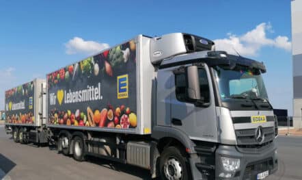 Truck advertising banner for Edeka in Gochsheim